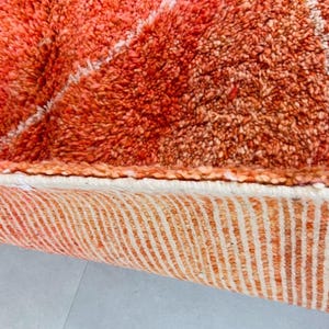 Statement Berber rug with intricate diamond motifs.