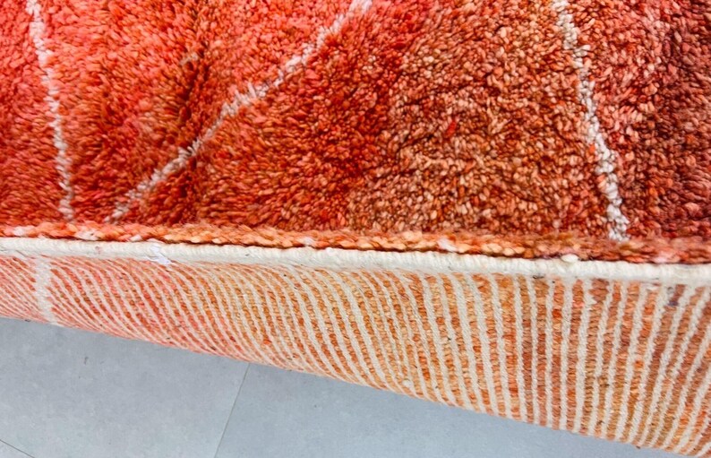 Statement Berber rug with intricate diamond motifs.