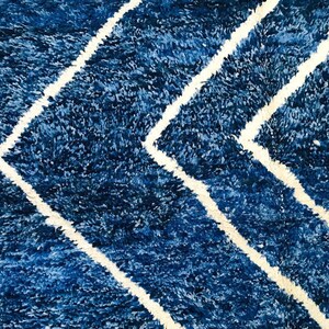 This custom Beni ourain rug has been handmade in Morocco with natural wool sheep. This Beni ourain rug is so soft, thick, and fluffy. That makes sitting so comfortable, and this Berber carpet will also warm you during winter.