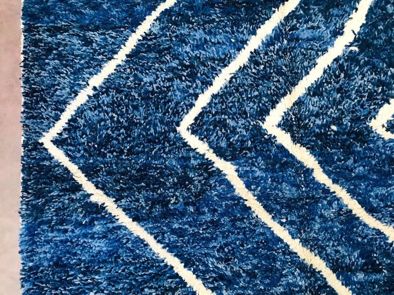 This custom Beni ourain rug has been handmade in Morocco with natural wool sheep. This Beni ourain rug is so soft, thick, and fluffy. That makes sitting so comfortable, and this Berber carpet will also warm you during winter.