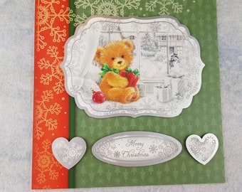 Merry Christmas card with a bear in the window on the card blank inside.