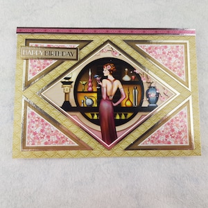 Happy Birthday card with a lady in pink dress on the card .