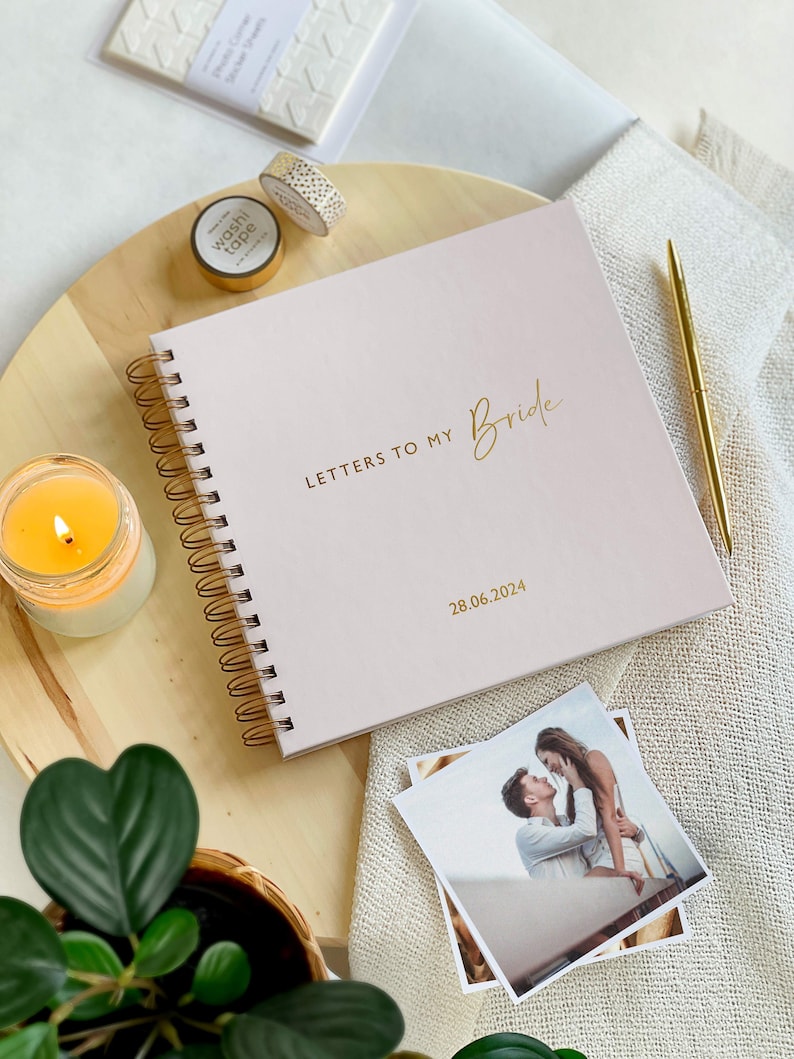 Blush pink and gold letters to the bride book with spiral wire binding and personalised wedding date on the cover