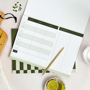inside page of week view menu planner showing space for breakfast, lunch, dinner and healthy snacks. The page also shows a large shopping list section which has a perforated line to tear-off.