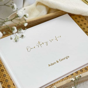 personalised hardcover memory book for couples with gold personalised names on the cover.