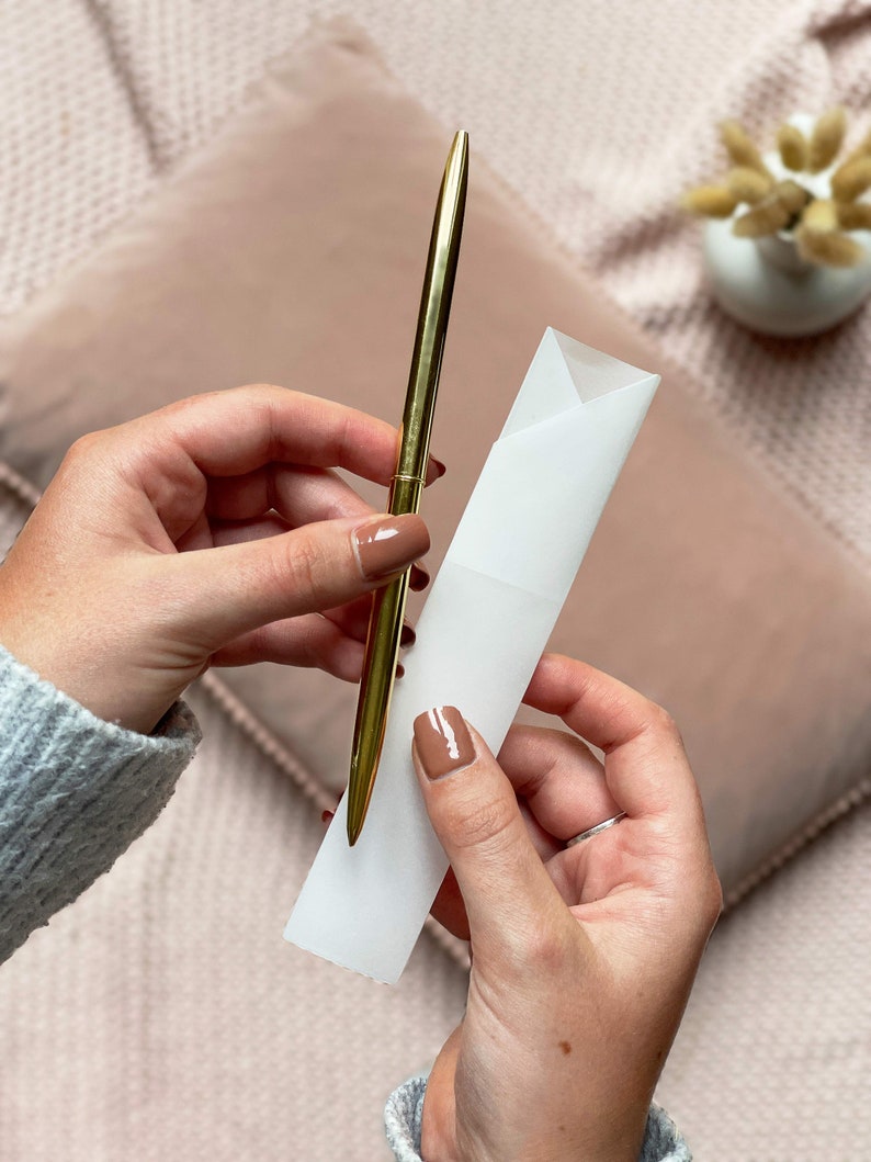 slim gold metal pen with luxury vellum envelope used for writing letters and advice to bride inside letters to bride book