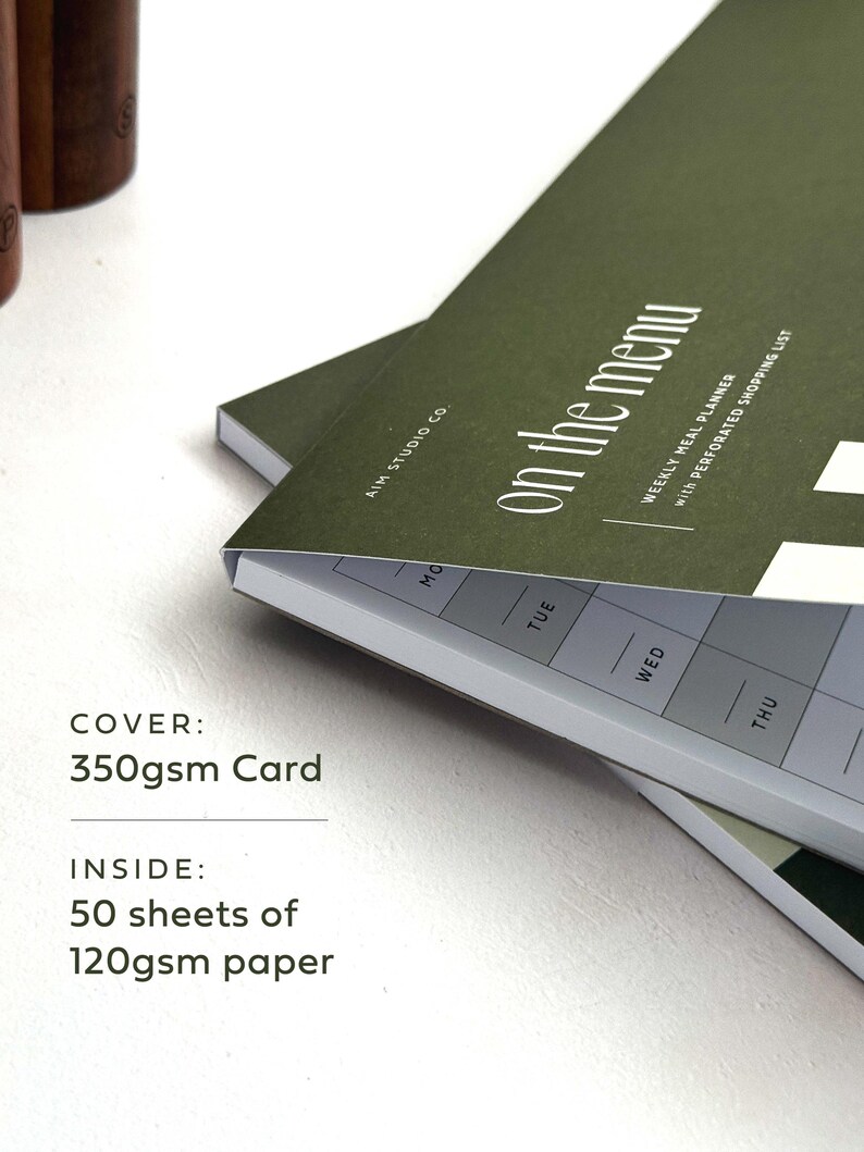 close up of green a4 notepad cover reading "on the menu" in white text. Descriptive text reads: cover, 350gsm card, inside: 50 sheets of 120gsm paper.