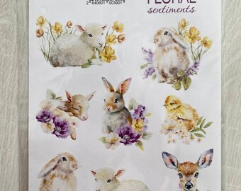 May include: A sheet of nine white stickers featuring watercolor illustrations of baby animals, including lambs, bunnies, a chick, and a fawn. The stickers are surrounded by floral designs in shades of purple, yellow, and white. The text "FDSTK - 390" and "White stickers 9 pcs FLORAL sentiments" is printed on the sheet.