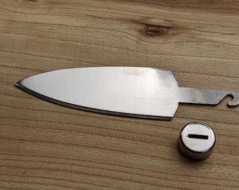 May include: A silver-colored knife with a pointed tip and a small loop at the end of the handle. A silver-colored round cap with a slot in the center is also shown.