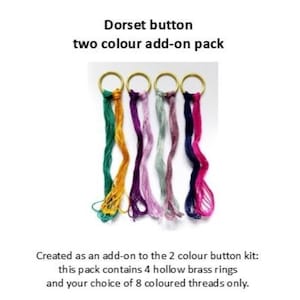 May include: A Dorset button two-colour add-on pack with four brass rings and threads in various colours: green, yellow, purple, pink, and blue. The image includes the text "Dorset button two colour add-on pack".