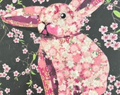 Paper collage art of a pink rabbit, Pink Bun by Wendy Boucher, 6x6”, ready to hang or sit on a shelf