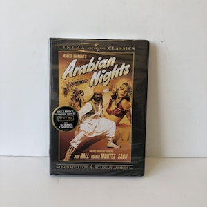 May include: A DVD of "Arabian Nights" from the Cinema Universal Classics collection. The cover features a vintage movie poster with illustrations of characters in Arabian attire. The DVD case is sealed in plastic.