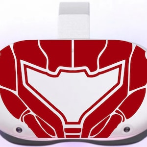 May include: A white virtual reality headset with a red and white graphic of a helmet on the front.