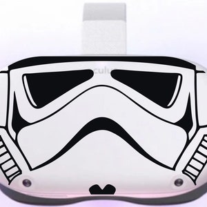 May include: A white VR headset with a black and white Stormtrooper helmet design on the front.
