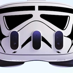 May include: A white virtual reality headset with a black and white Stormtrooper helmet design on the front.