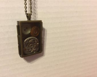 Locket with antique buttons