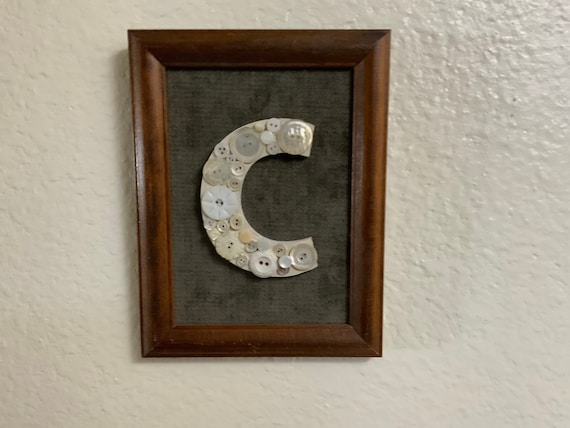 Letter “C” made with buttons