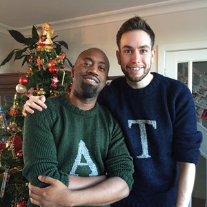 Men wearing a green Magical Christmas Weasley sweater with an A and other dark blue  handwoven jumper with personalized with a custom capital letter T on her chest