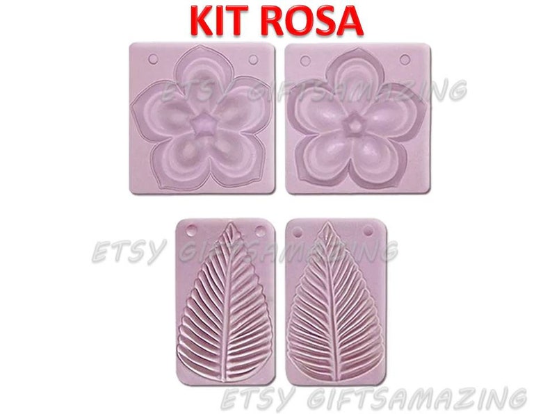Puede incluir: Un juego de dos moldes de silicona para manualidades. Un molde presenta un dise&ntilde;o de flor, el otro un dise&ntilde;o de hoja. Los moldes son de color rosa y tienen las palabras "KIT ROSA" impresas en la parte superior.