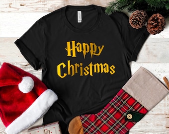 May include: Black t-shirt with gold lettering that reads "Happy Christmas" in a Harry Potter-inspired font.