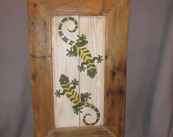 Hand painted geckos wall art on reclaimed wood.