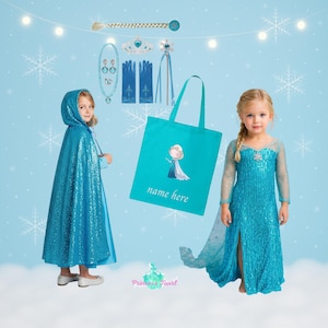 May include: A collection of children's Frozen-themed accessories and costumes. Includes a blue sequined cape, a long blue dress, a tote bag with a character illustration, gloves, a necklace, a tiara, and a hair accessory. The background is light blue with snowflakes.