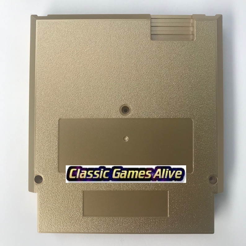 May include: A gold-colored video game cartridge with a textured surface. The cartridge has a rectangular label with the text "Classic Games Alive" in a stylized font. The cartridge has a rectangular shape with rounded corners.