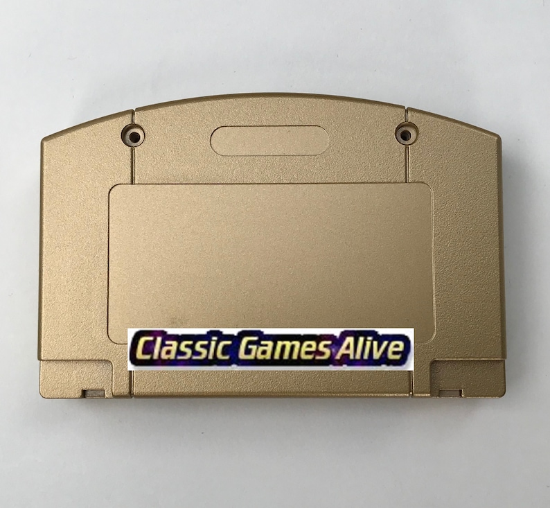 May include: A gold-colored video game cartridge with the text "Classic Games Alive" on a sticker. The cartridge has a rectangular label area and two screw holes near the top.