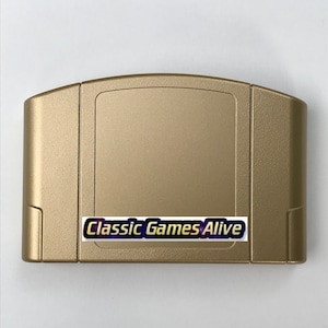 May include: A gold-colored Nintendo 64 game cartridge. The cartridge has a rectangular shape with a slightly textured surface. A sticker on the front reads "Classic Games Alive" in a stylized font.