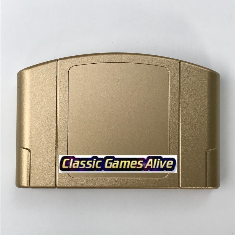 May include: A gold-colored Nintendo 64 game cartridge. The cartridge has a rectangular shape with a slightly textured surface. A sticker on the front reads "Classic Games Alive" in a stylized font.