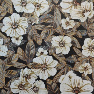 May include: A white floral mosaic tile with a black background. The flowers are arranged in a repeating pattern and have a realistic appearance. The tile is made of small pieces of glass and stone.