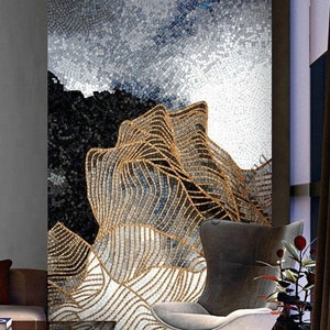 May include: A mosaic wall art featuring a stylised mountain range with gold and blue accents. The artwork is made of small, square tiles and has a modern, abstract design.