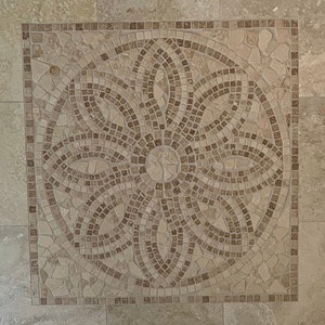May include: A square mosaic tile floor with a circular design in the center. The design is made of small, irregular pieces of beige and brown stone arranged in a geometric pattern.