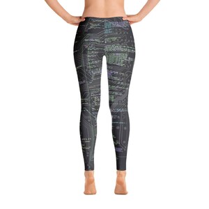 May include: Black leggings with a pattern of computer code printed on them.