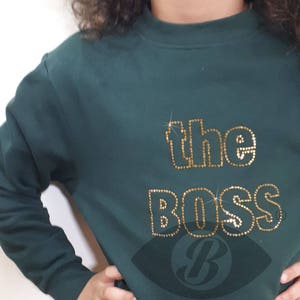 the Boss gold rhinestones on green sweater image 1