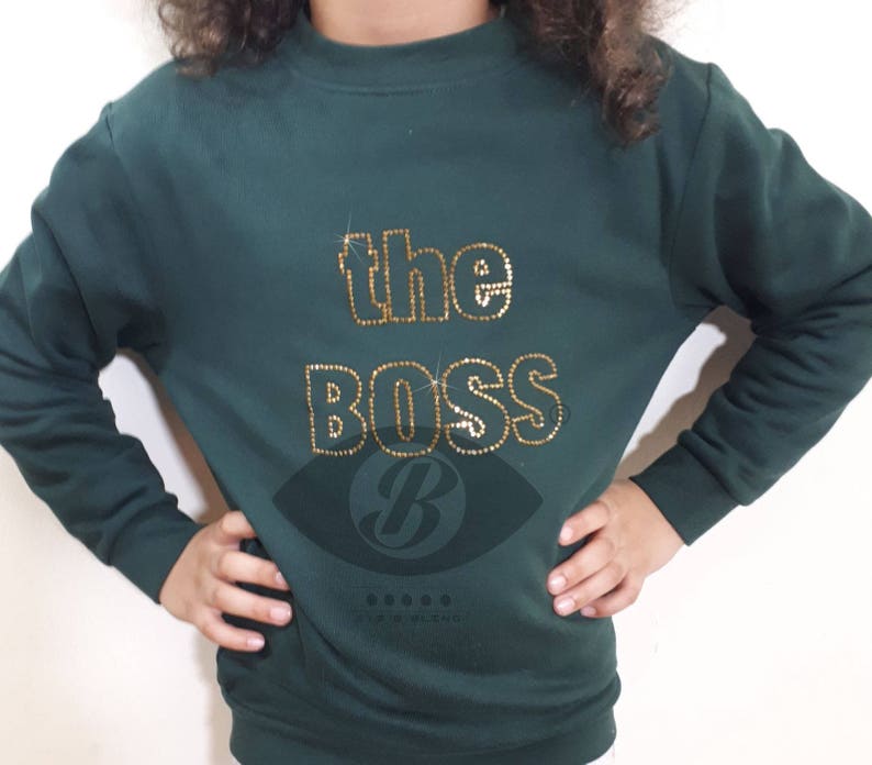 the Boss gold rhinestones on green sweater image 1