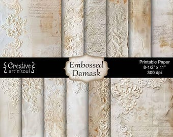 May include: A collection of 12 pages of printable paper with an embossed damask design. The paper has a vintage aesthetic with a cream and beige color palette. Each page features a different floral pattern. The paper size is 8-1/2" x 11".