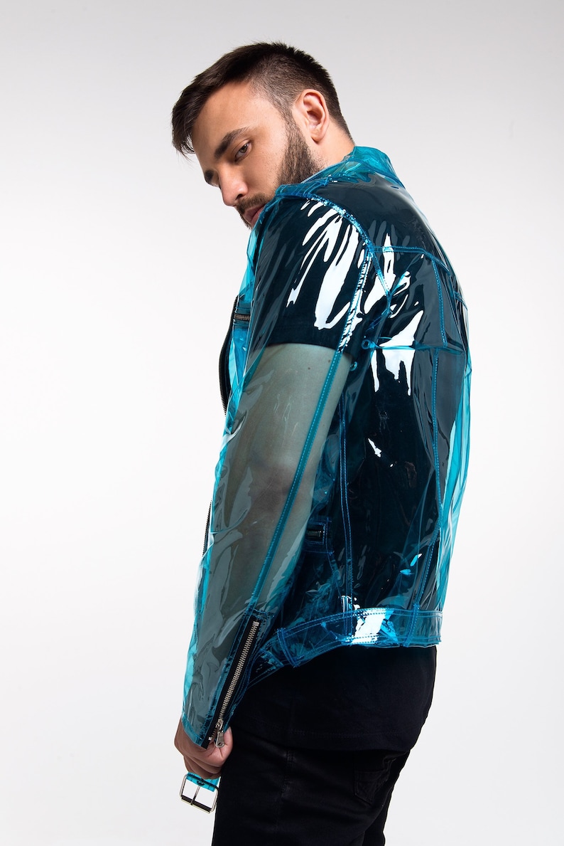 May include: A blue transparent jacket with a zip fastening and a black t-shirt underneath.