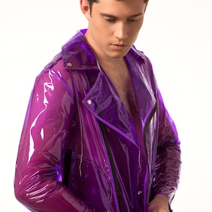 May include: A purple transparent vinyl jacket with a zip closure and black trim. The jacket has a stand-up collar and long sleeves.