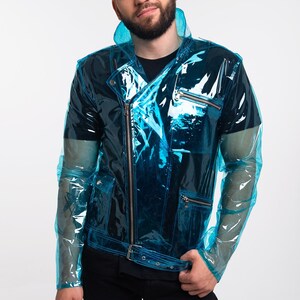 May include: A transparent blue jacket with a zip fastening and a belt. The jacket has a biker style with multiple pockets and a collar.