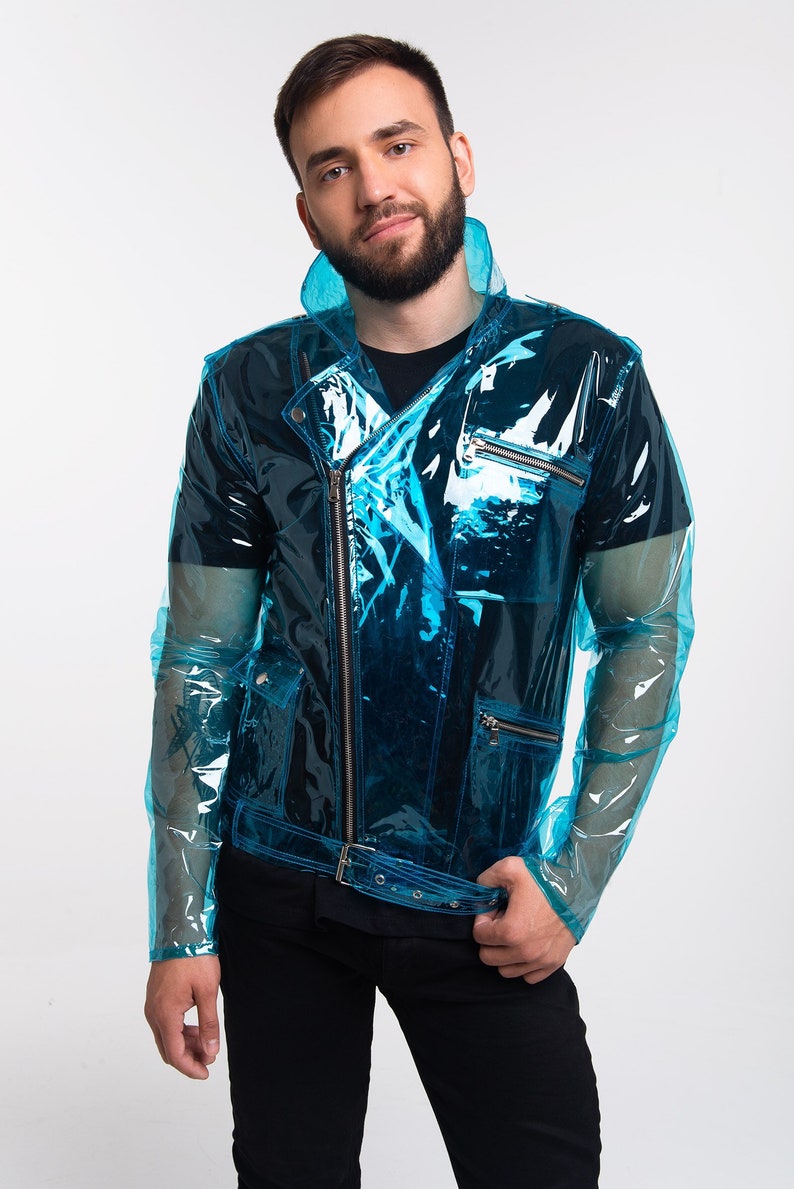 May include: A transparent blue jacket with a zip fastening and a belt. The jacket has a biker style with multiple pockets and a collar.