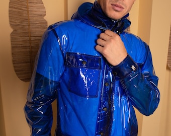 May include: A transparent blue jacket with a hood and button closure. The jacket has a shiny, almost wet look.