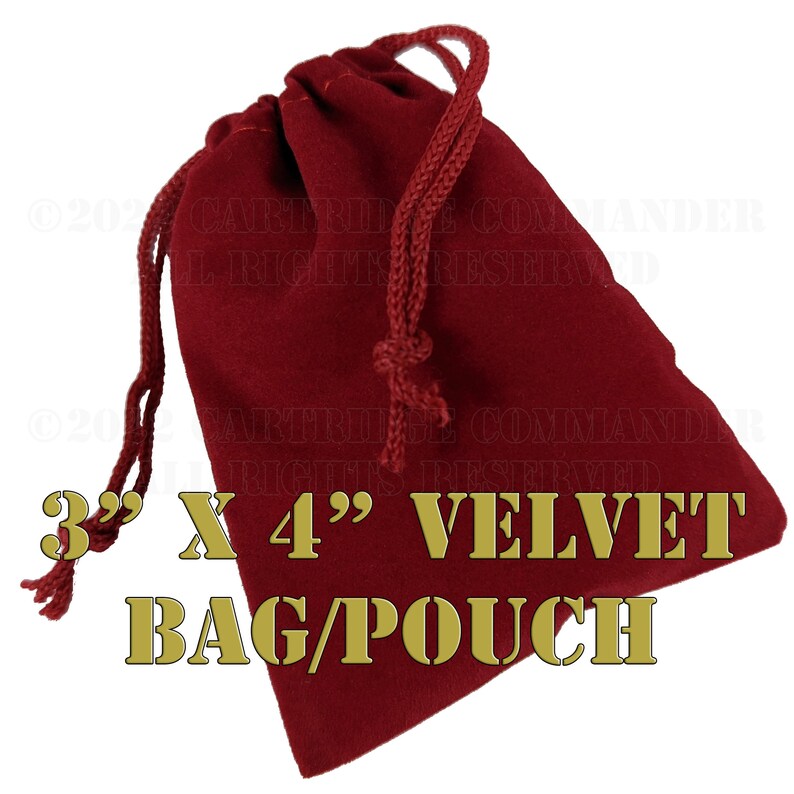 May include: A burgundy velvet bag or pouch with a drawstring closure. The bag measures 3 inches by 4 inches. The text "3" X 4" VELVET BAG/POUCH" is printed in gold.