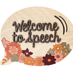 May include: A wooden speech therapy sign in the shape of a speech bubble with the text "Welcome to Speech" in brown lettering. The sign is decorated with a floral border in shades of orange, pink, and green.