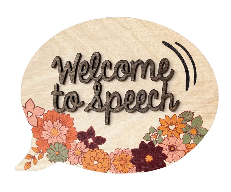 May include: A wooden speech therapy sign in the shape of a speech bubble with the text "Welcome to Speech" in brown lettering. The sign is decorated with a floral border in shades of orange, pink, and green.