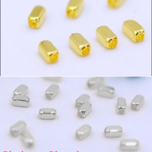 Può includere: Perle in metallo placcato oro e argento. Le perle dorate misurano 2 mm x 2 mm x 4 mm. Le perle argentate misurano 2 mm x 2 mm x 4 mm.
