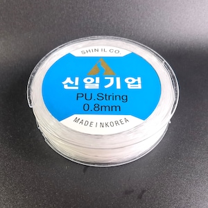 May include: A spool of white PU string, 0.8mm thick, made in Korea. The label reads "Shin Il Co. 신일기업 PU.String 0.8mm MADE IN KOREA".