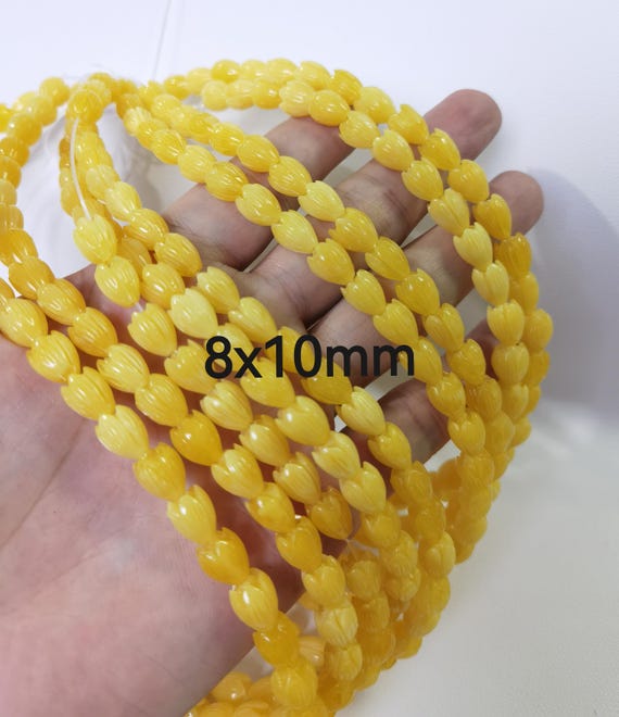 ハワイアンピカケビーズ、8 x 10 mm 10 x 12 mm イエローフラワー