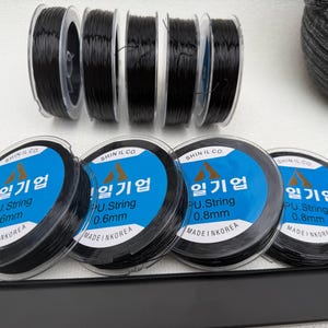 Cuerda elástica negra para pulseras, bobina elástica, hilo de calidad superior, hilo para abalorios de pulseras, carrete de hilo elástico, cuerdas de alambre para joyería.