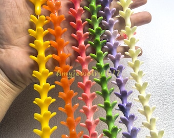 May include: Six strands of colorful plastic beads, each featuring a repeating branch-like or floral shape. The strands are yellow, orange, pink, green, purple, and cream. The text Amyjewelry1012 is visible in the center of the image.